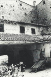 1930 Hostal del Angel with Moorish wall behind